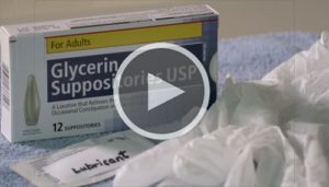 Box of glycerin suppositories, lubricant and latex gloves